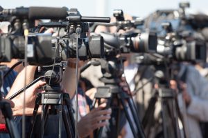 News conference. Filming an event with a video camera.